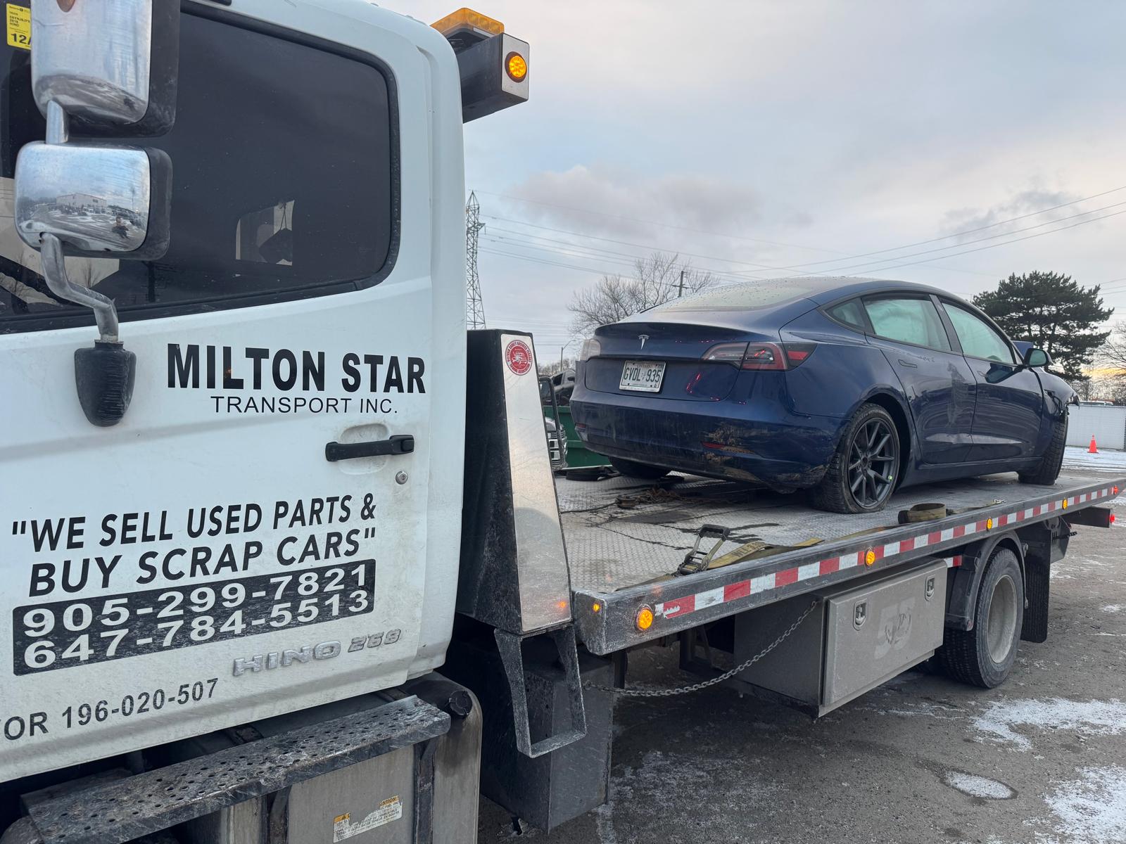 Milton Star Transport flatbed with Tesla Model 3